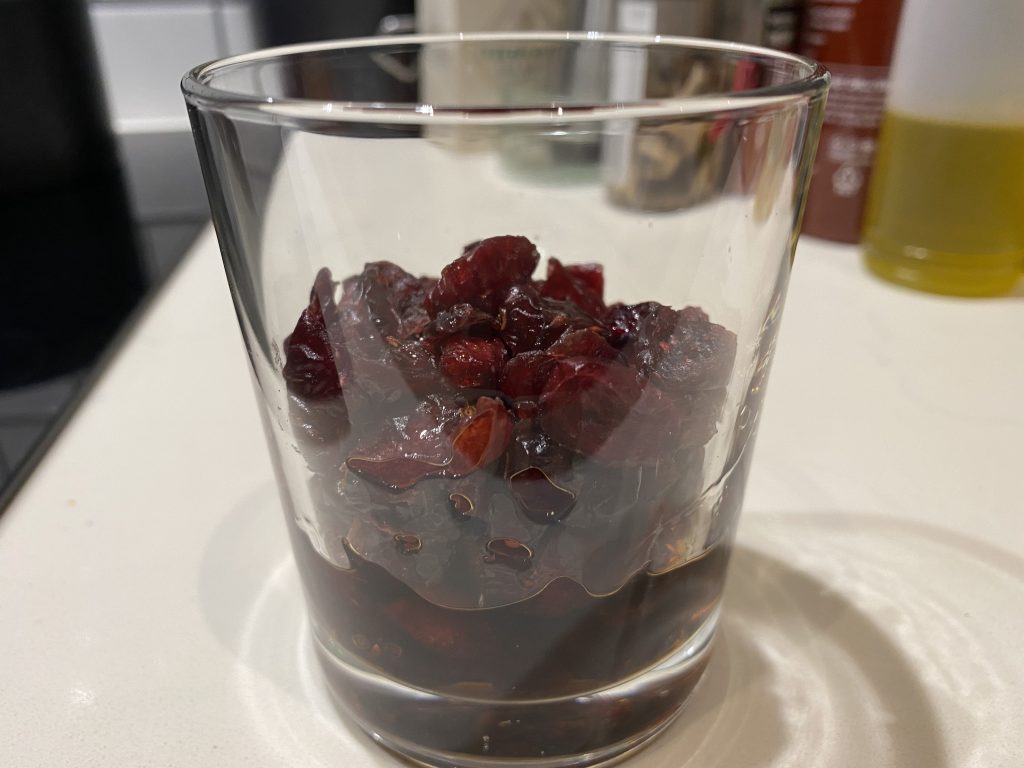 Soaking dried cranberries in rum for Kaiserschmarrn