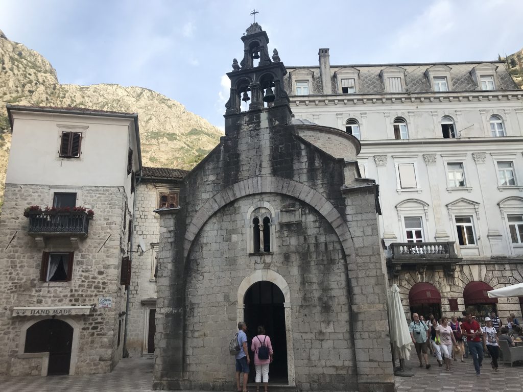 Old Town Kotor Orthodox Church with the fortress behind on the hill