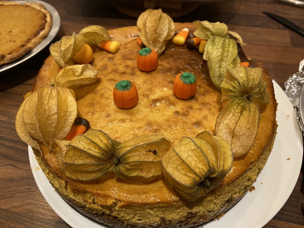 Pumpkin cheesecake decorated with physallis and candies