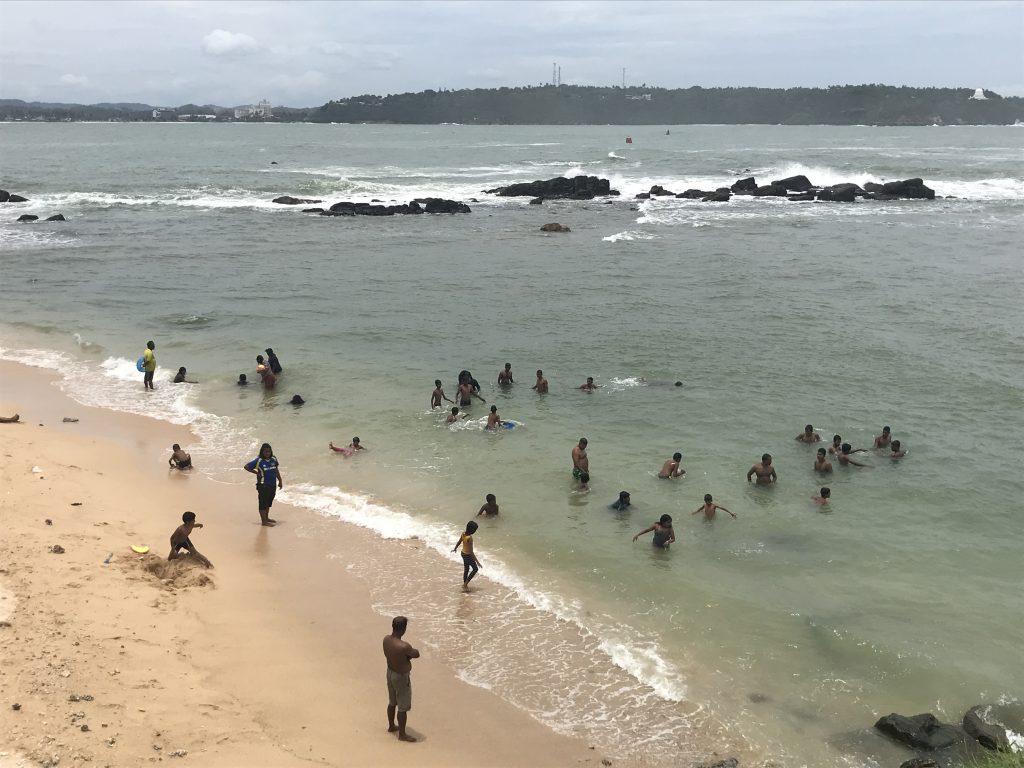 Galle Beach with locals swimming