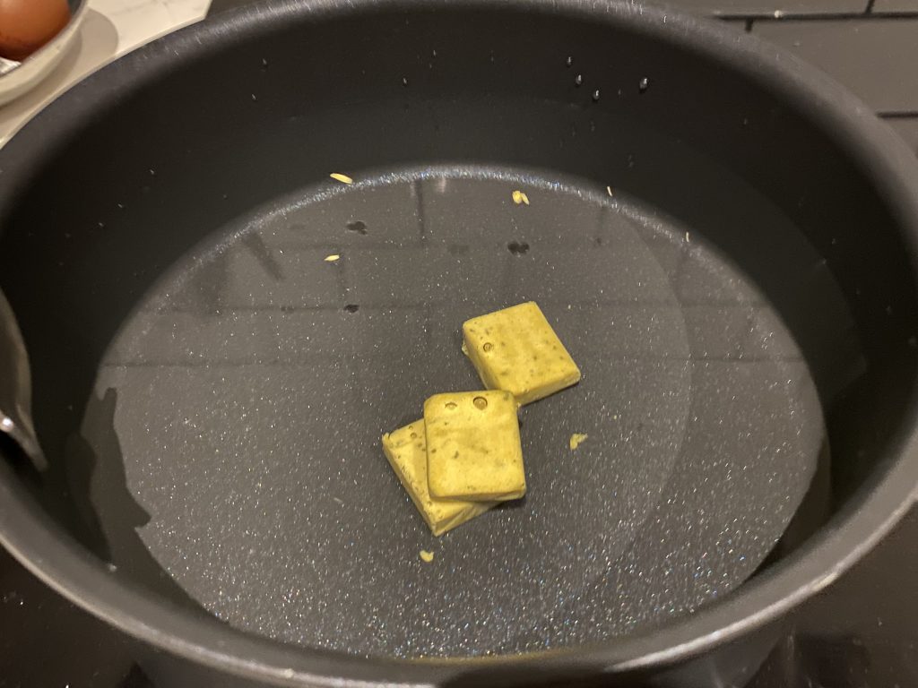 Dissolve chicken bouillon cubes in water