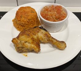 Amiwo with chicken and tomato onion sauce