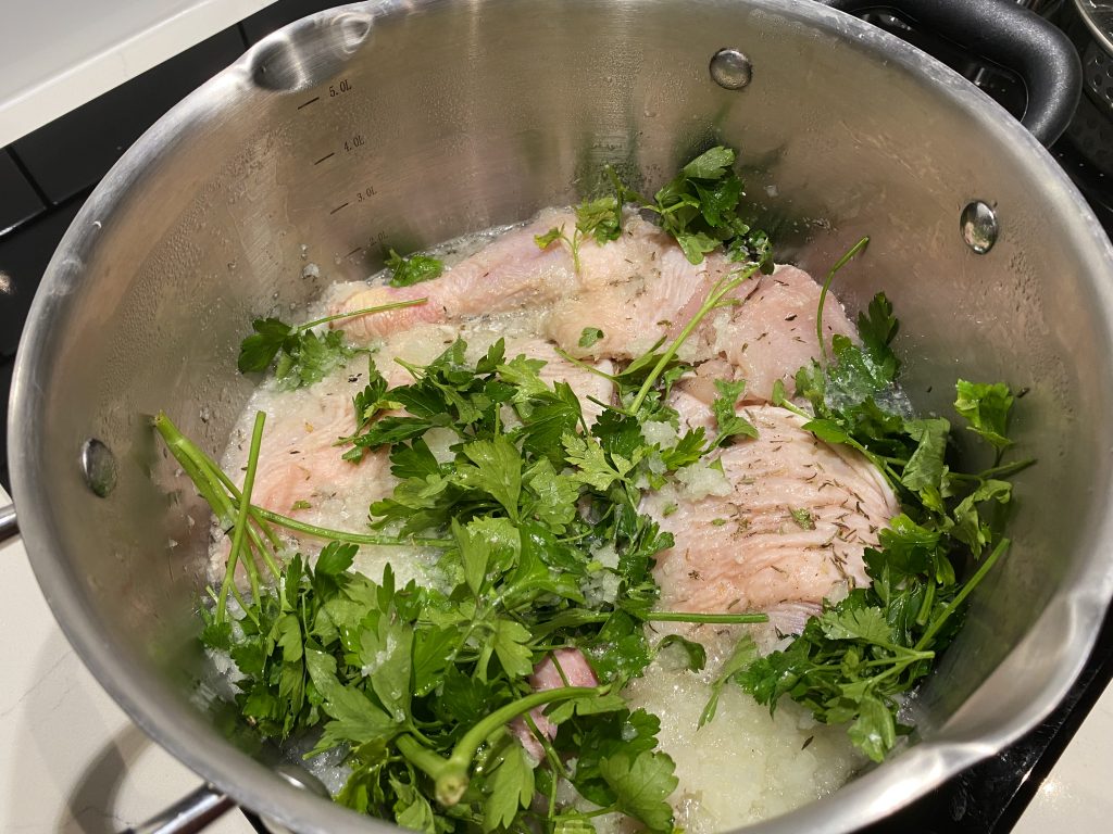Cooking the chicken with herbs