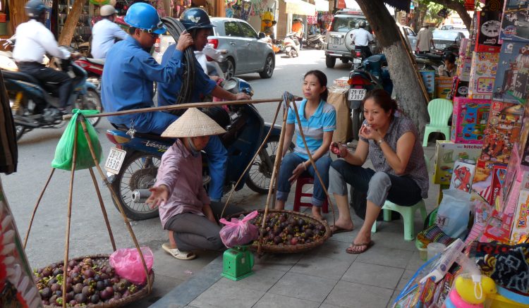 Street vendor selling fruits in Hanoi