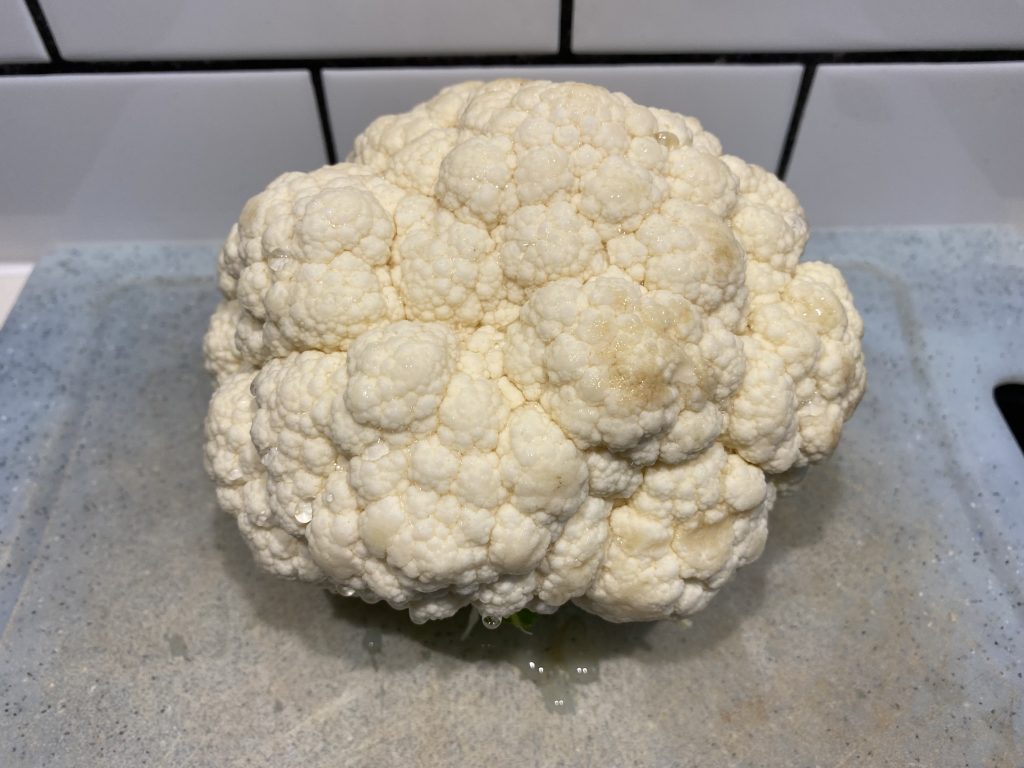 Wash the cauliflower and remove most of the leaves and stem
