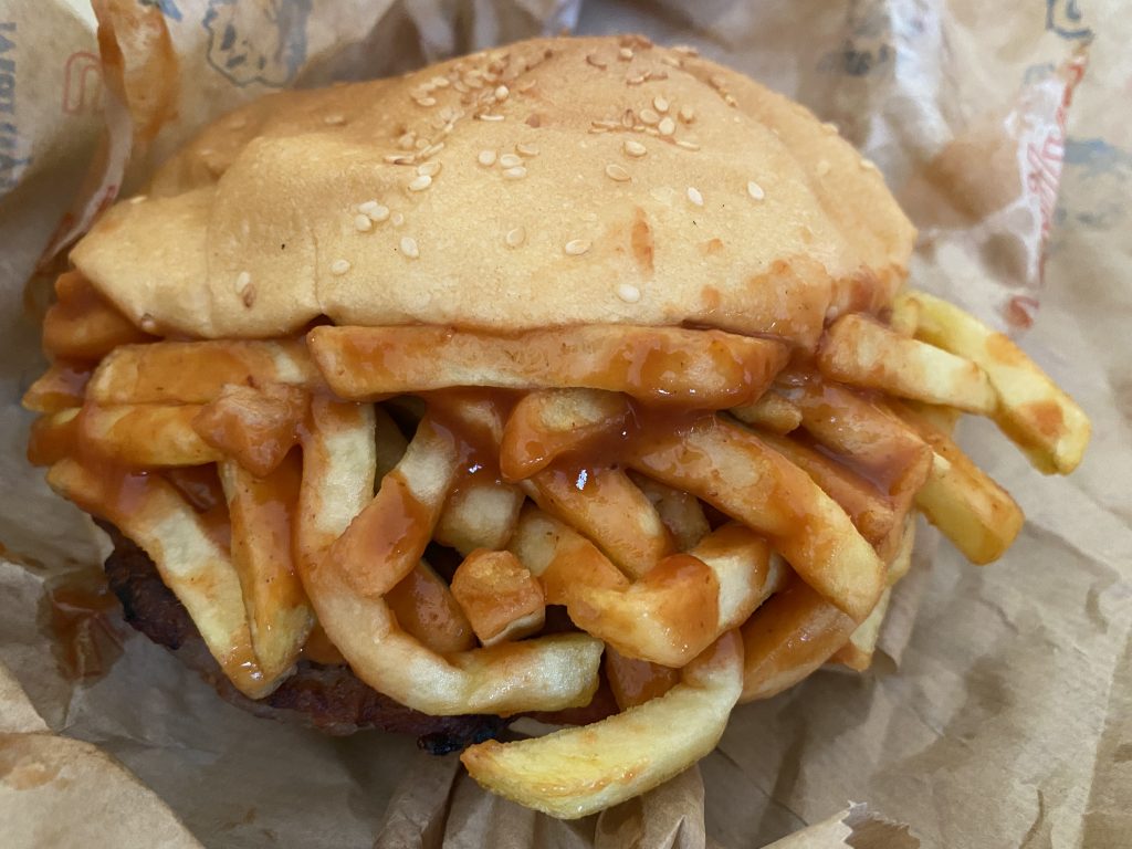 Fast Food Marilyn Burger filled with fries and ketchup