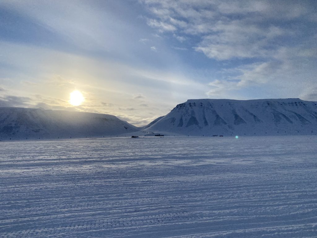 Snowy mountains with Arctic sun