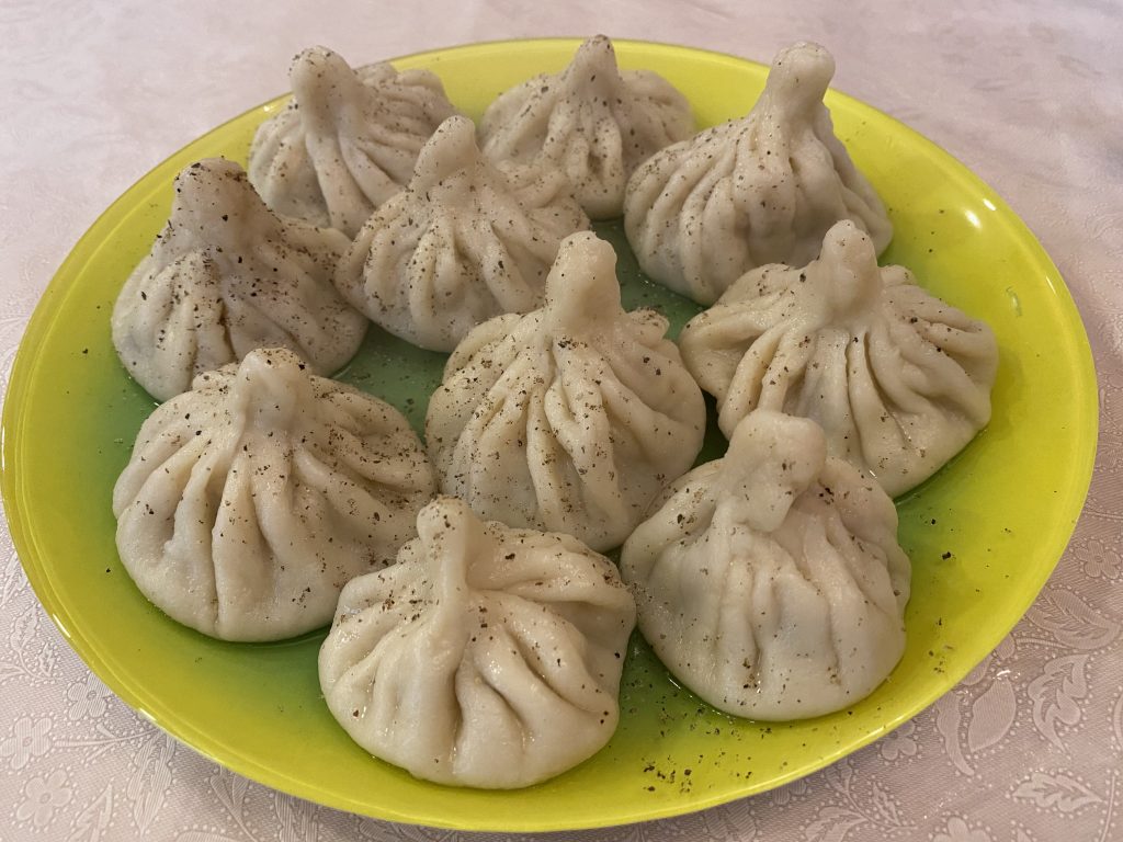 Freshly cooked khinkali with pepper