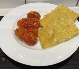 Calentita served with tomatoes