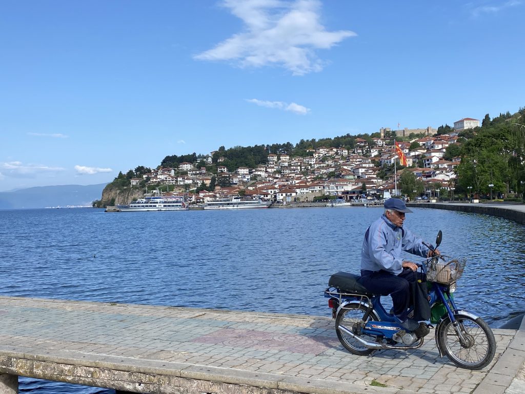 Motorcycle riding down the Lake Ohrid pier
